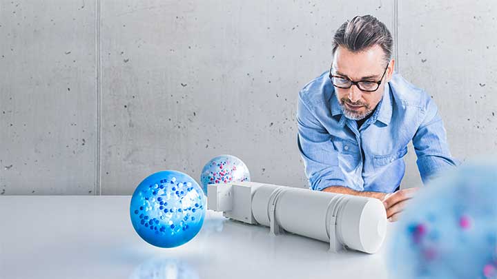 rendering of a man looking at a model of a cryogenic tank
