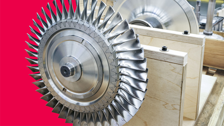 Close-up of a turbocharger turbine wheel with detailed blades